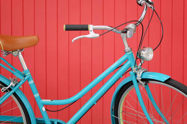 istock Blue vintage bicycle on red wooden wall background 2000154983