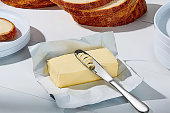 close up of knife and butter on the table