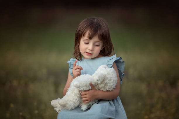 Portraits of a beautiful 4-year-old Argentine girl in a flower field- Buenos Aires - Argentina