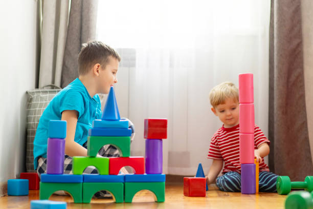istock Creative Playtime Children with Colorful Building Blocks 2000193047