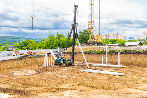 Сonstruction work in a pit - a pile foundation for a heavy structure with soft soils, selective focus