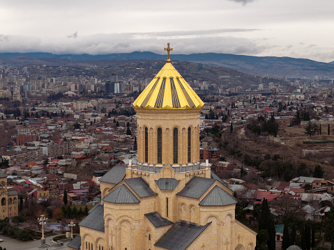 Aerial view of Tsminda Sameba Cathedral, Tbilisi Georgia. Taken via drone.