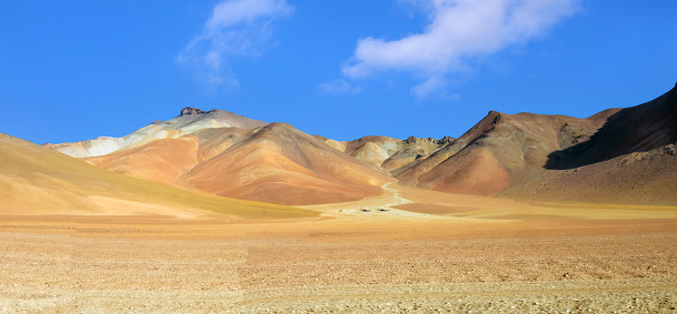 Crossing the Salvador DalÃ­ Desert (Desierto Salvador DalÃ­), an extremely barren valley in the Eduardo Avaroa Andean Fauna National Reserve, Bolivia