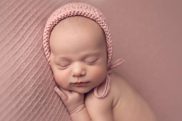istock Newborn baby girl sleeping 2000214766