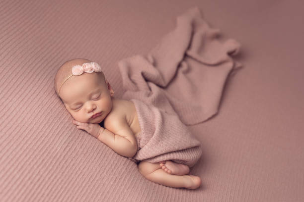 istock Newborn baby girl sleeping 2000216144