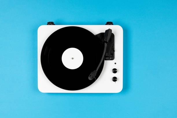 istock Vinyl turntable with vinyl plate on a blue background. Modern gramophone record player. Retro sound technology to play music 2000251718
