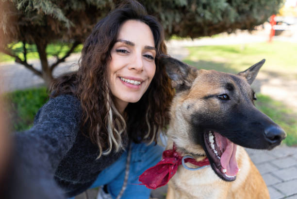 istock Dog and owner taking a selfie in a public park 2000272166