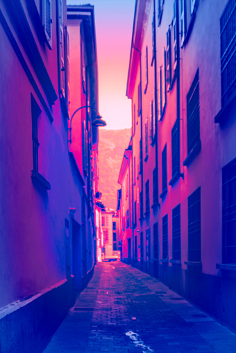 Alleyway in Como, Italy.  An alleyway given a surreal look to convey danger.