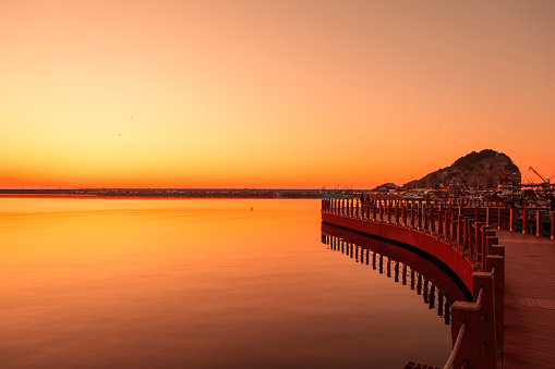 wooden curved pier in şile istanbul beautiful sunset