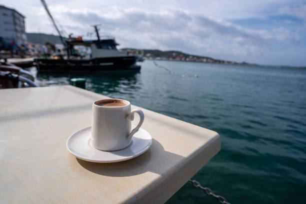 istock turkish coffee is on table at sea shore focus on foreground seascape is background horizontal travel still 2000363717