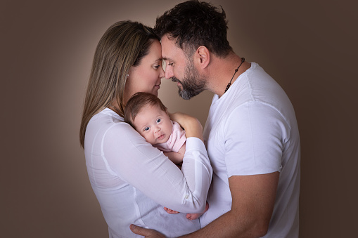 Real mother and father holding their newborn baby girl - Buenos Aires - Argentina - Latin America