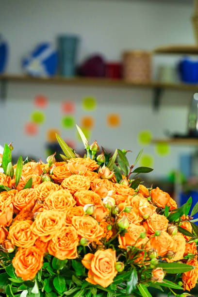 istock Vibrant Orange Roses Adorning Table, Copy Space 2000496033