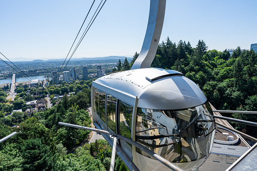 An Aerial Tram stopped at the upper station of the Portland Aerial Tram at the Oregon Health & Science University commonly referred to as OHSU.