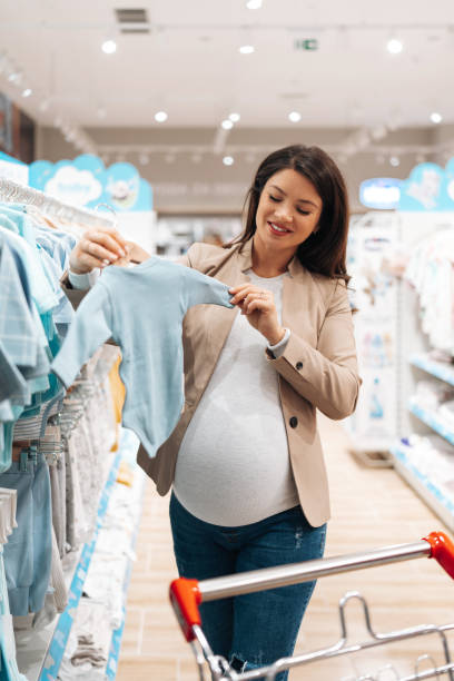 istock Young couple in baby shop 2000522412