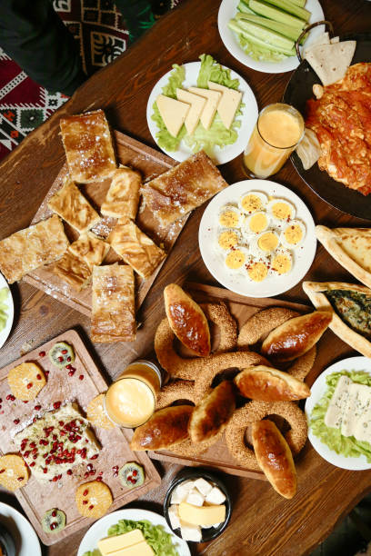 istock Wooden Table Laden With Plates of Food 2000526121