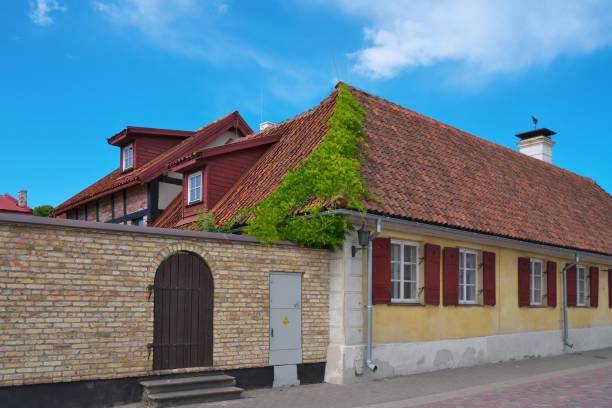 istock A house with a tiled roof and shutters on the windows. 2000528243