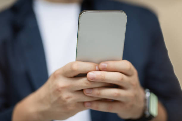 istock Young caucasian man student in casual typing on mobile phone, chatting in social networks 2000531415
