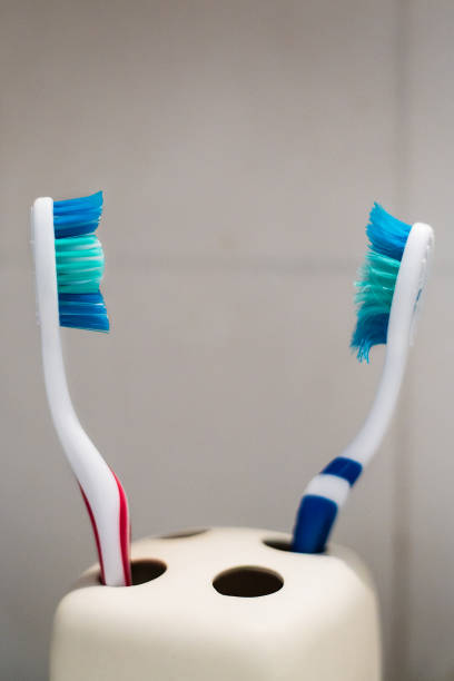istock Closeup shot of two toothbrushes, new and used 2000538215