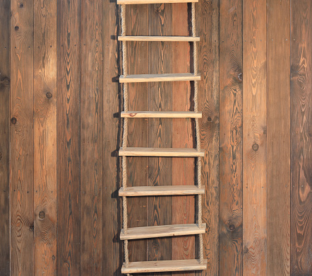 rope ladder on a wooden wall