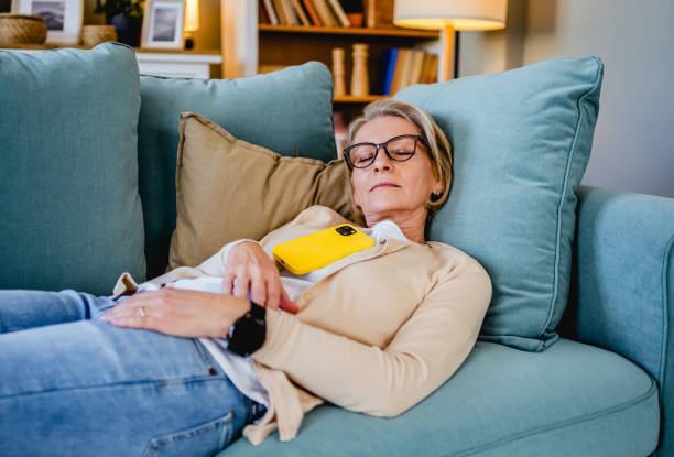 Tired woman taking a nap on the sofa