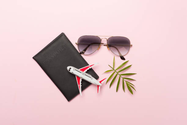 Traveler accessories on color background, top view