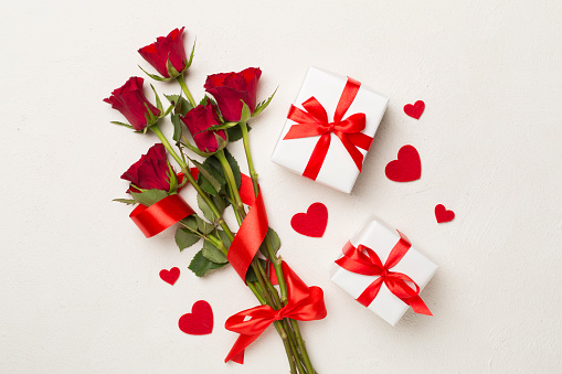 Valentine's Day/Love & Romance Lifestyle Millennial Recieving Female with Gifts and Flowers