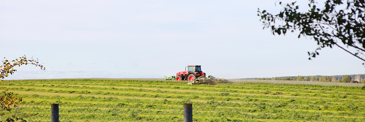 a tractor in the field plows the land
