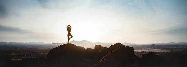 istock woman doing yoga on the mountain 2000615487
