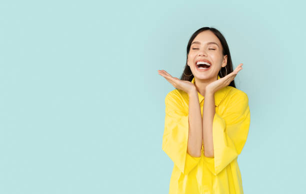 istock Happy young pretty brunette woman laughing and gesturing 2000619419