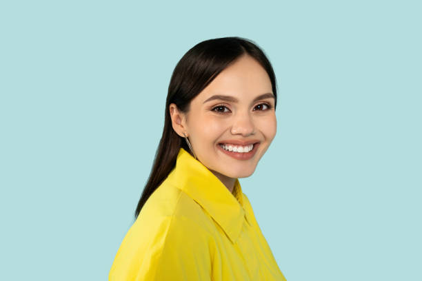 istock Studio portrait of cheerful young woman smiling at camera 2000620579