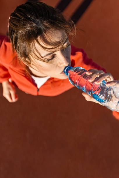 Sporty Woman's Refreshing Jog and Sip