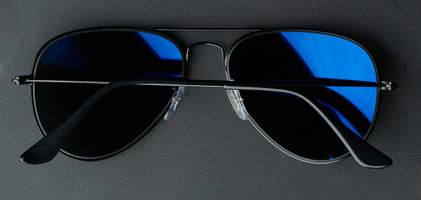 A pair of black sunglasses isolated on a white background, clipping path is included
