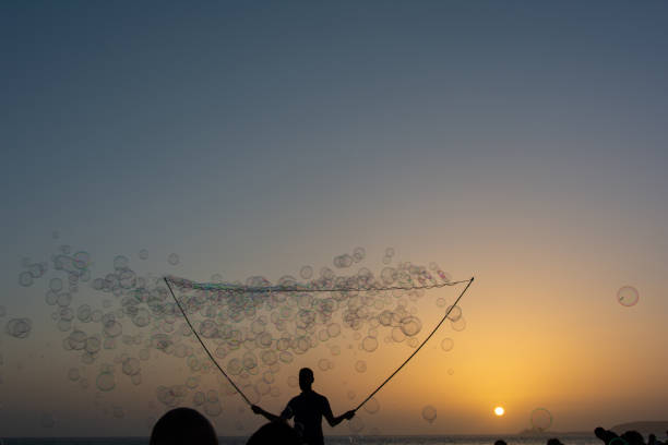 istock A man makes lots of soap bubbles with a bubble stick 2000649670
