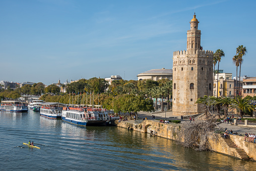 Andalusia, Spain - February 22, 2019: Landscape with the Guadalquivir river and the Torre del Oro, in the city of Seville