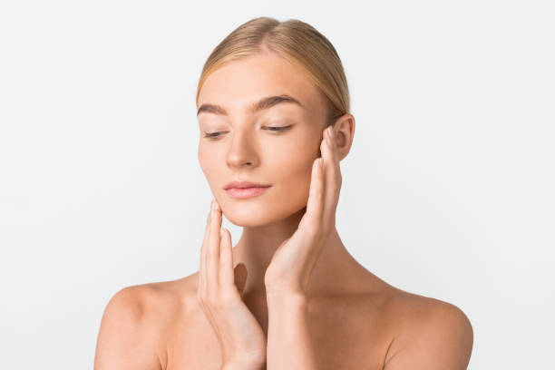 istock Blonde Woman With Perfect Skin Posing Over White Studio Background 2000687482