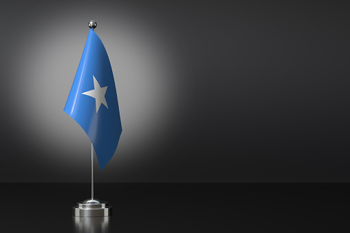 Small National Flag of the Federal Republic of Somalia on a Black Background. 3d Rendering