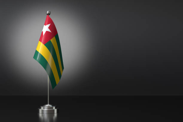 istock Small National Flag of the Togolese Republic on a Black Background. 3d Rendering 2000763845