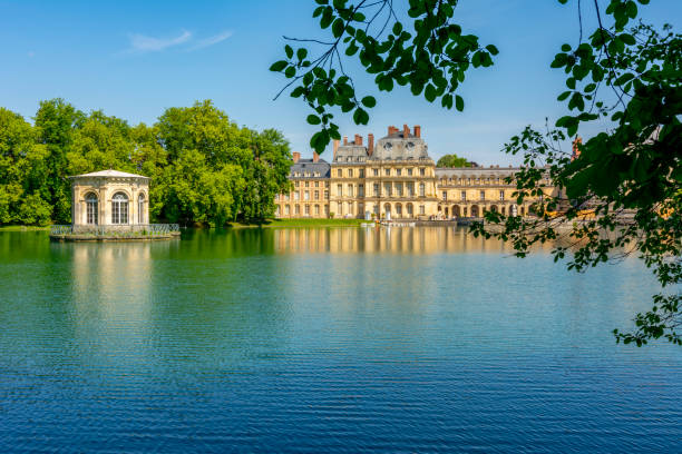 Fontainebleau palace (Chateau de Fontainebleau) and park near Paris, France Fontainebleau, France - May 2019: Fontainebleau palace and park near Paris in spring chateau de fontainbleau stock pictures, royalty-free photos & images