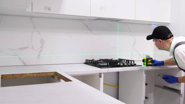 istock A service technician installs a gas stove in the kitchen using an electronic laser. 4k video 2000784167