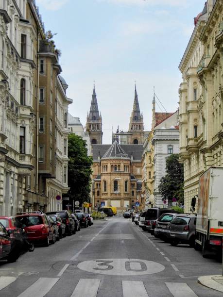 Vienna old town historical building ancient columns balcony architecture downtown main street square tower church cathedral city center downtown circle Austria
