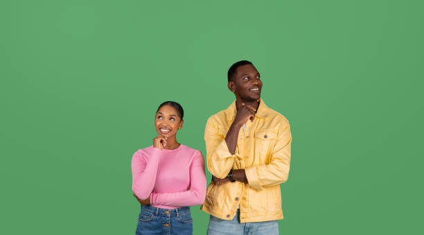 istock Excited african american man and woman looking aside 2000862483