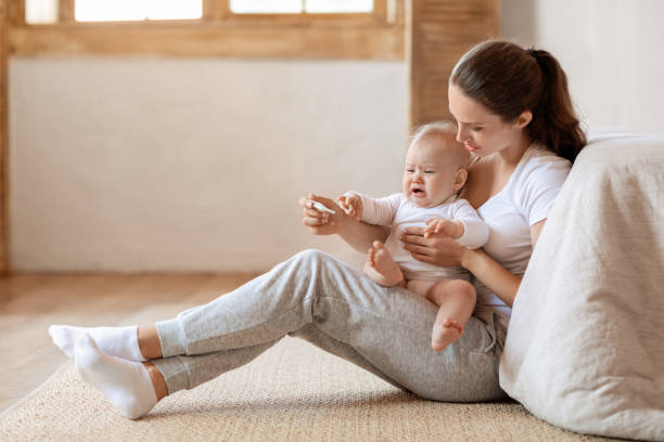 istock Mother testing temperature of infant kid, child, check for fever 2000890014