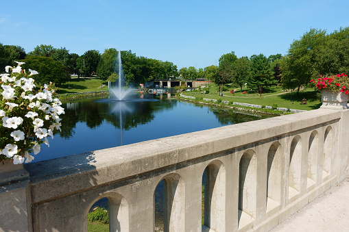 Beautiful public park and fountain, view from a bridge