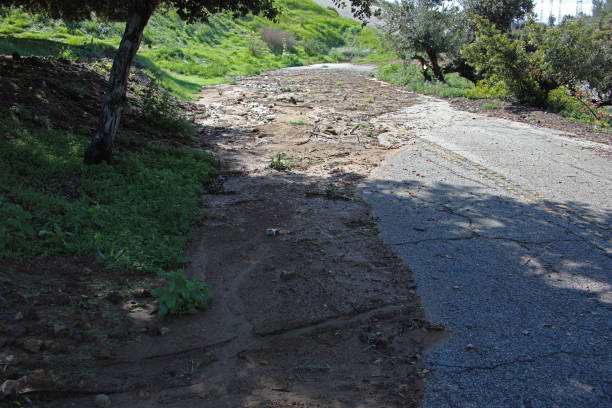 istock Mud Debris Across Paved Road 3 2001011946