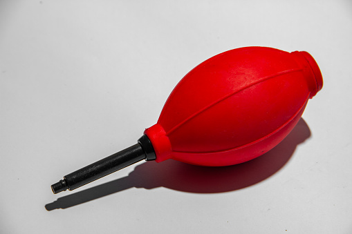 Pocket air blower for photo camera on white background