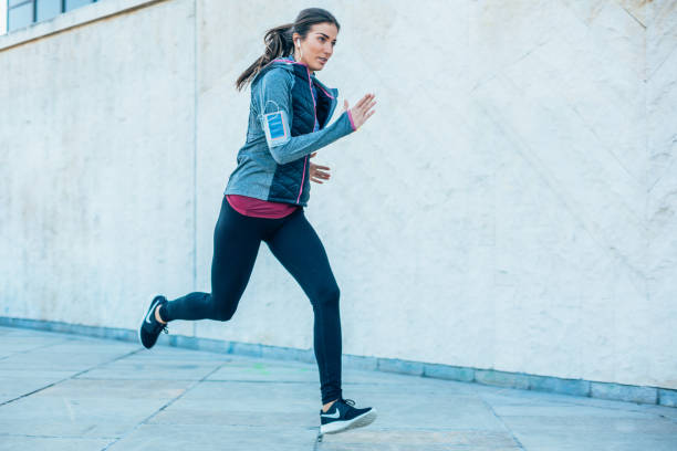 istock Woman jogging in the city 2001038287
