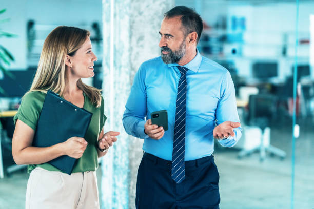 istock Business colleagues talking in the office 2001038799