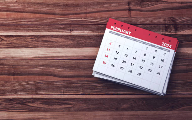 istock February 2024 Calendar sitting on Dark Wooden background 2001163729