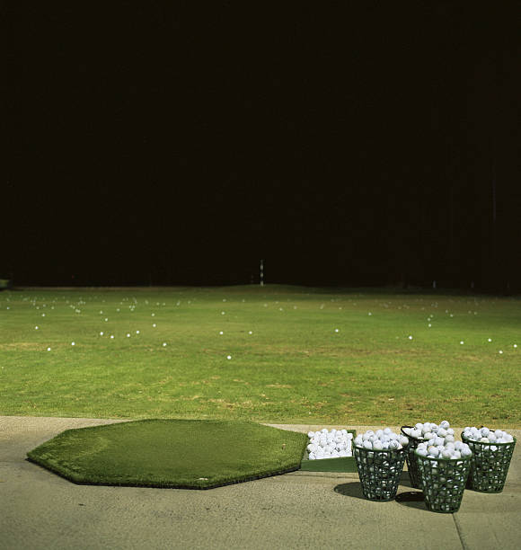 Golf driving range at night  night golf stock pictures, royalty-free photos & images