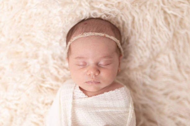 istock Newborn baby girl sleeping 2001210174